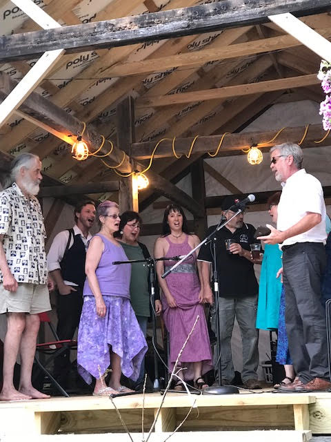 Friends singing one of Crow's favorite sons at his memorial service